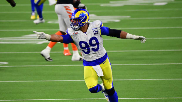 Feb 13, 2022; Inglewood, California, USA; Los Angeles Rams defensive tackle Aaron Donald (99) celebrates after a pressure in the fourth quarter against the Cincinnati Bengals in Super Bowl LVI at SoFi Stadium. Mandatory Credit: Gary A. Vasquez-USA TODAY Sports